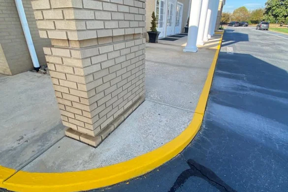 Commercial exterior remodel with painted concrete curbing